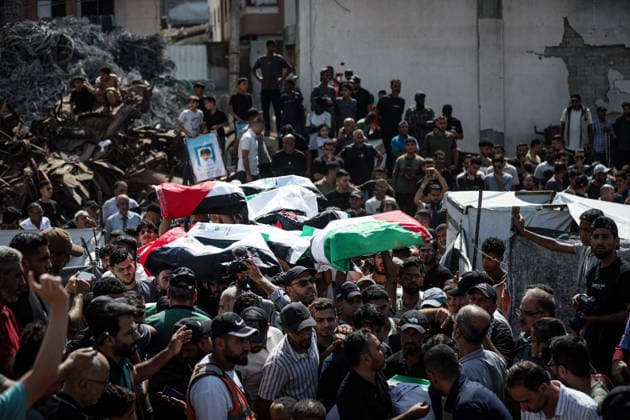 Palestinians Hold Mass Funeral for 105 Recovered from Gaza Rubble Palestinians take part in a mass funeral for 105 Palestinians whose remains were recovered from beneath the rubble of destroyed buildings in the al-Taj area of Gaza City’s al-Yarmouk neighborhood on October 1, 2026. The victims, including women and children, were killed in Israeli airstrikes during the early stages of the war, with families gathering for their funeral and burial after their remains had been trapped under the rubble for years. Photo by Bilal Osama apaimages Gaza city Gaza Strip Palestinian Territory 011026_Gaza_BO_00(30) Copyright: xapaimagesxBilalxOsamax xapaimagesx