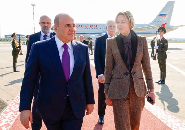 BELARUS, MINSK - OCTOBER 1, 2026: Russia s Prime Minister Mikhail Mishustin (L front) is welcomed at Minsk National Airport. Pictured R front: Belarus Deputy Prime Minister Natalya Petkevich Minsk Belarus - ZUMAt113 20261001_zaa_t113_120 Copyright: xDmitryxAstakhovx