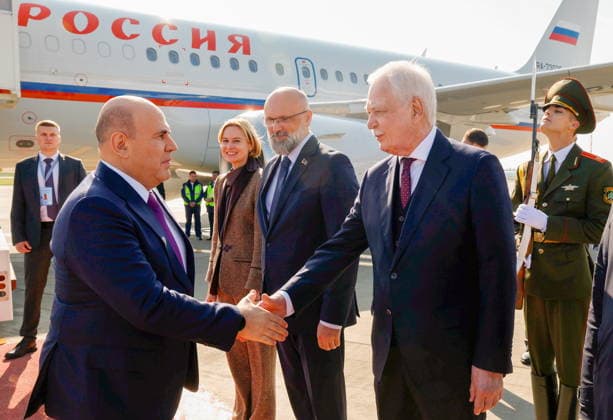 BELARUS, MINSK - OCTOBER 1, 2026: Russia s Prime Minister Mikhail Mishustin (2nd L) and Russia s Ambassador to Belarus Boris Gryzlov (2nd R) shake hands at Minsk National Airport Minsk Belarus - ZUMAt113 20261001_zaa_t113_123 Copyright: xDmitryxAstakhovx
