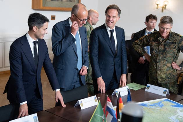Visit to the German-Dutch Corps by Federal Chancellor Merz and Rob Jetten, Prime Minister of the Netherlands, together with Federal Chancellor Friedrich Merz, NATO Secretary General Mark Ruette listen intently to the remarks by Lieutenant General Peter Mirow, who is holding a map of Europe during a visit to the 1st German-Dutch Corps, Münster, October 1, 2026, Münste