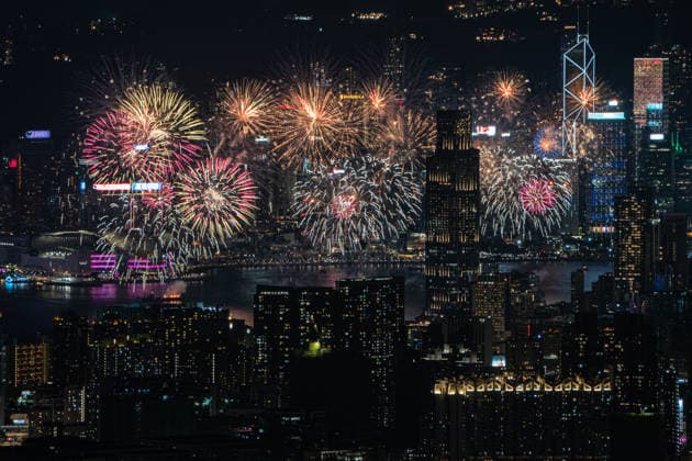 HONG KONG-DAILY NATIONAL-DAY A panoramic general view captured from Kowloon Peak (Fei Ngo Shan) shows fireworks illuminating the night sky above Victoria Harbour during the 77th National Day celebration on October 1, 2026 in Hong Kong, overlooking the expansive cityscapes of the southern Kowloon Peninsula and the illuminated skyline of northern Hong Kong Island. (Photo by Kevin Li TMHK via Nexpher Images) Hong Kong