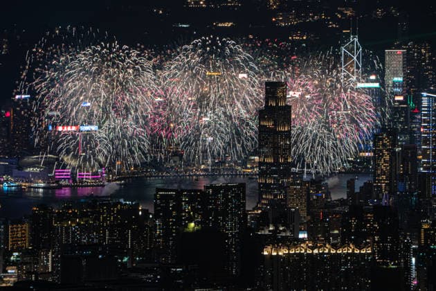 HONG KONG-DAILY NATIONAL-DAY A panoramic general view captured from Kowloon Peak (Fei Ngo Shan) shows fireworks illuminating the night sky above Victoria Harbour during the 77th National Day celebration on October 1, 2026 in Hong Kong, overlooking the expansive cityscapes of the southern Kowloon Peninsula and the illuminated skyline of northern Hong Kong Island. (Photo by Kevin Li TMHK via Nexpher Images) Hong Kong