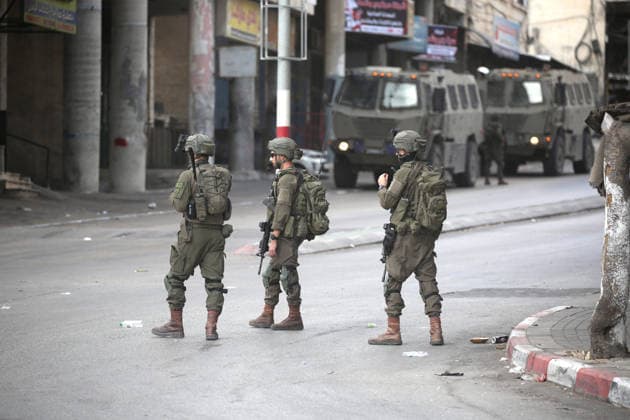 Israel enforces Security as Jewish visitors arrive to pray during the festival of Sukkot in Nablus, Palestine Israeli soldiers guard the street and secure the route surrounding Joseph s Tomb a religious site contested by Israelis and Palestinians as Jewish visitors arrive late at night to pray inside during the Jewish festival of Sukkot; the shrine is located in an area under Palestinian Authority control. Nablus Palestine Copyright: xNasserxishatyehx xSOPAxImagesx Nishtayeh671