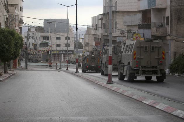 Israel enforces Security as Jewish visitors arrive to pray during the festival of Sukkot in Nablus, Palestine Israeli soldiers guard the street and secure the route surrounding Joseph s Tomb a religious site contested by Israelis and Palestinians as Jewish visitors arrive late at night to pray inside during the Jewish festival of Sukkot; the shrine is located in an area under Palestinian Authority control. Nablus Palestine Copyright: xNasserxishatyehx xSOPAxImagesx Nishtayeh677