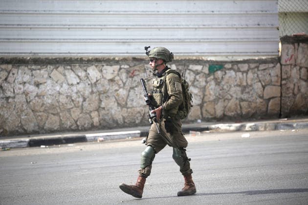 Israel enforces Security as Jewish visitors arrive to pray during the festival of Sukkot in Nablus, Palestine Israeli soldiers guard the street and secure the route surrounding Joseph s Tomb a religious site contested by Israelis and Palestiniansas Jewish visitors arrive late at night to pray inside during the Jewish festival of Sukkot; the shrine is located in an area under Palestinian Authority control. Nablus Palestine Copyright: xNasserxishatyehx xSOPAxImagesx Nishtayeh670