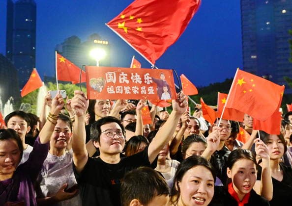(261001) -- BEIJING, Oct. 1, 2026 -- People attend a flag-raising ceremony marking the 77th anniversary of the founding of the People s Republic of China at Wuyi Square in Fuzhou, southeast China s Fujian Province, Oct. 1, 2026. People celebrated the 77th anniversary of the founding of the People s Republic of China in various ways on Thursday. ) CHINA-NATIONAL DAY-CELEBRATION (CN) LinxShanchuan