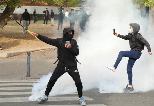 Student protest in Paris PARIS, FRANCE - SOCTOBER 1: Protesters kick tear gas canister amid clashes with French riot police during a protest by high school and university students near Lycee Paul Eluard high school in Saint-Denis, near Paris, France, on October 1, 2026. Mohamad Salaheldin Abdelghani Alsayed Anadolu Paris France. Editorial use only. Please get in touch for any other usage.  Copyright: x2026xAnadoluxMohamadxSalaheldinxAbdelghanixAlsayedx