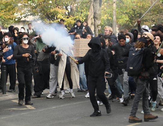 Student protest in Paris PARIS, FRANCE - SOCTOBER 1: A masked protester carries a smoke canister to throw at French riot police during a protest by high school and university students near Lycee Paul Eluard high school in Saint-Denis, near Paris, France, on October 1, 2026. Mohamad Salaheldin Abdelghani Alsayed Anadolu Paris France. Editorial use only. Please get in touch for any other usage.  Copyright: x2026xAnadoluxMohamadxSalaheldinxAbdelghanixAlsayedx