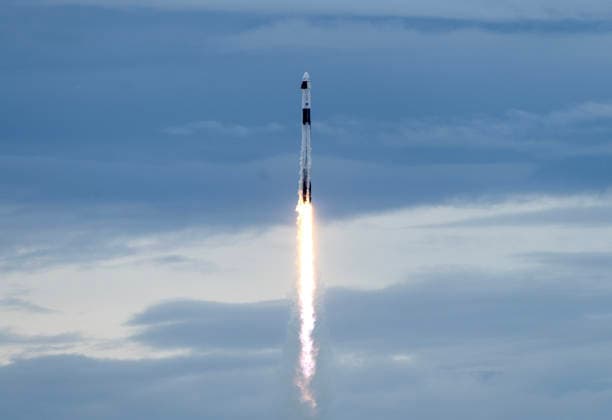 NASA s Crew-13 Mission Space X Falcon 9 streaks through the clouds as it launches from Launch Complex LC-40 at Cape Canaveral, Florida to the International Space Station on Thursday, October 1, 2026. Aboard the Dragon Spacecraft are Astronaut Jessica Watkins, commander, Astronaut Luke Delaney,pilot, and Mission Specialists Joshua Kutryk of the Canadian Space Agency and Sergey Teteryatnikov of Roscosmos  KSC2026100155 PATxBENIC
