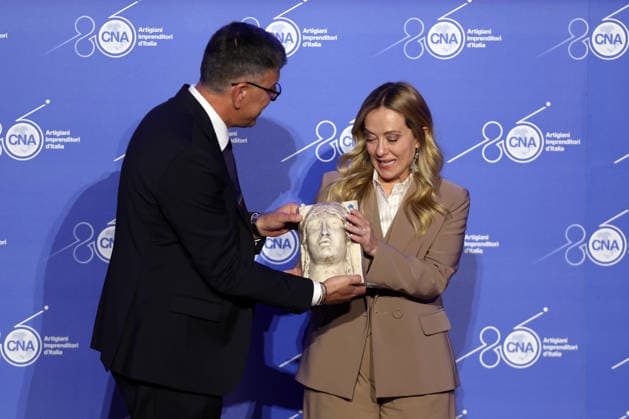 IPA89184692 - Rome, Italy October 1, 2026 CNA President Dario Costantini presents an award and a bouquet of flowers to Giorgia Meloni. Celebrations marking the 80th anniversary of the CNA are taking place at the Antonianum Auditorium. Prime Minister Giorgia Meloni is scheduled to attend the event at 5:00 p.m. for a gathering dedicated to the world of Italian crafts and small and medium-sized enterprises. Copyright: xmarcoxiacobuccix xmarcoxiacobuccix IPA89184692