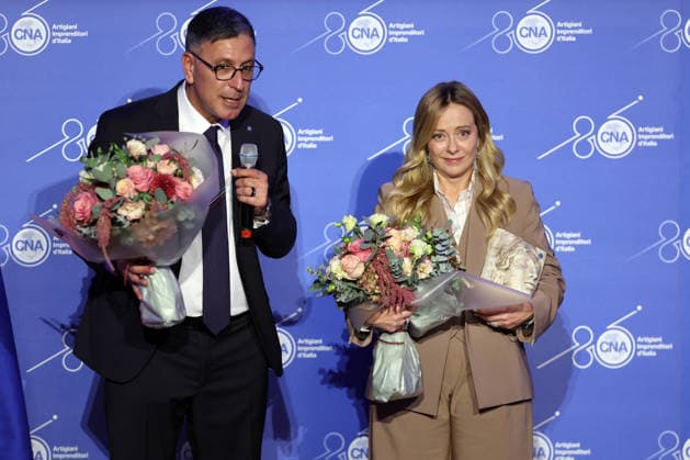 IPA89184711 - Rome, Italy - October 1, 2026 CNA President Dario Costantini presents an award and a bouquet of flowers to Giorgia Meloni. Celebrations marking the 80th anniversary of the CNA are taking place at the Antonianum Auditorium. Prime Minister Giorgia Meloni is scheduled to attend the event at 5:00 p.m. for a gathering dedicated to the world of Italian crafts and small and medium-sized enterprises. Copyright: xmarcoxiacobuccix xmarcoxiacobuccix IPA89184711