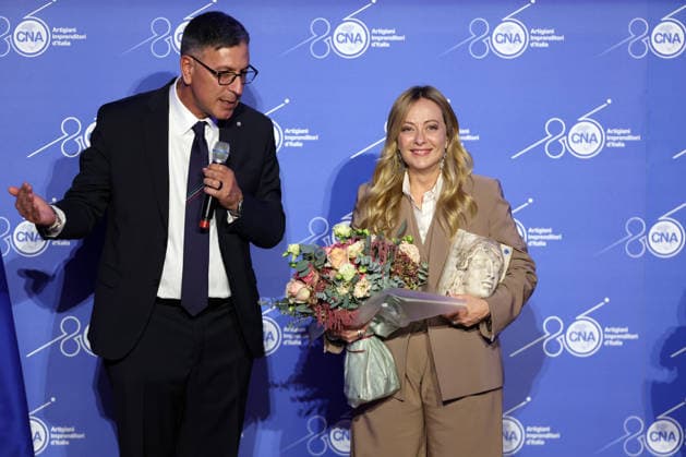 IPA89184712 - Rome, Italy October 1, 2026 CNA President Dario Costantini presents an award and a bouquet of flowers to Giorgia Meloni. Celebrations marking the 80th anniversary of the CNA are taking place at the Antonianum Auditorium. Prime Minister Giorgia Meloni is scheduled to attend the event at 5:00 p.m. for a gathering dedicated to the world of Italian crafts and small and medium-sized enterprises. Copyright: xmarcoxiacobuccix xmarcoxiacobuccix IPA89184712