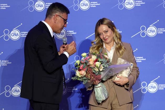 IPA89184708 - Rome, Italy October 1, 2026 CNA President Dario Costantini presents an award and a bouquet of flowers to Giorgia Meloni. Celebrations marking the 80th anniversary of the CNA are taking place at the Auditorium Antonianum. Prime Minister Giorgia Meloni is expected to attend the event at 5 p.m. for a gathering dedicated to the world of Italian craftsmanship and small and medium-sized enterprises.  Copyright: xmarcoxiacobuccix xmarcoxiacobuccix IPA89184708