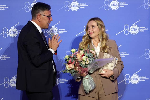 IPA89184709 - Rome, Italy October 1, 2026 CNA President Dario Costantini presents an award and a bouquet of flowers to Giorgia Meloni. Celebrations marking the 80th anniversary of the CNA are taking place at the Antonianum Auditorium. Prime Minister Giorgia Meloni is scheduled to attend the event at 5:00 p.m. for a gathering dedicated to the world of Italian craftsmanship and small and medium-sized enterprises. Copyright: xmarcoxiacobuccix xmarcoxiacobuccix IPA89184709