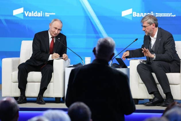 RUSSIA, MOSCOW REGION - OCTOBER 1, 2026: Russia s President Vladimir Putin and Research Director of the Foundation for Development and Support of the Valdai Discussion Club, Editor-in-Chief of the Russia in Global Affairs Journal, Fyodor Lukyanov (L-R back) are seen during a plenary session titled Responsibility for the Future: Limits of the Possible or Possibilities Without Limit? at the 23th annual meeting of the Valdai Discussion Club in Istra Russia - ZUMAt113 20261001_zaa_t113_395 Copyright: xAlexanderxShcherbakx
