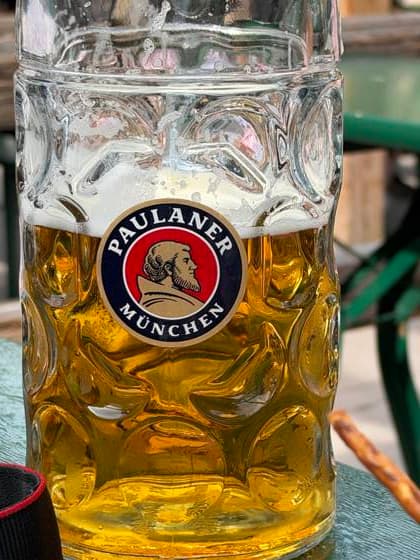 Oktoberfest in Munich, Munich, Oktoberfest, October 26, 2011. A lively atmosphere during the final days of Oktoberfest, with glorious sunshine and temperatures over 20 degrees. A half-full Maß of Paulaner beer, Munich, Theresienwiese, Bavaria, Germany