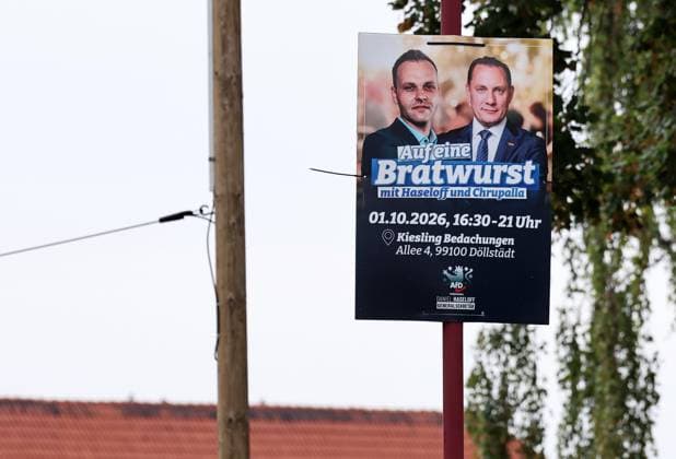 Enjoying a Bratwurst with Haseloff and Chrupalla, October 1, 2026, Doellstaedt, AfD event at Kiesling Roofing; enjoying a bratwurst with State Parliament Representative Daniel Haseloff (AfD) and AfD National Spokesperson Tino Chrupalla pictured; poster for the event featuring the likenesses of Daniel Haseloff (AfD) and Tino Chrupalla (AfD)