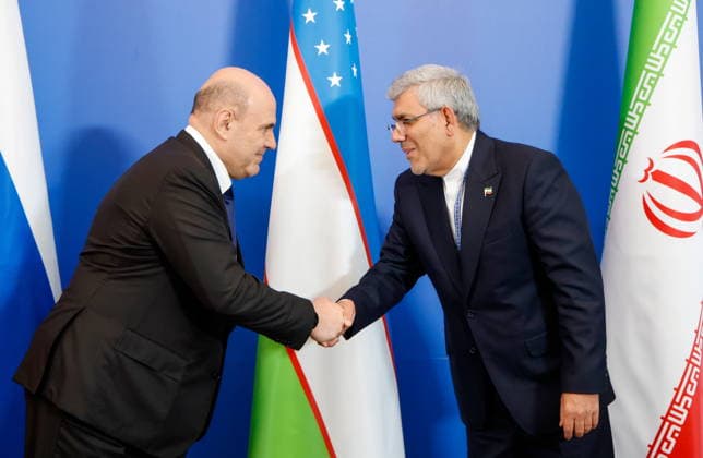 BELARUS, MINSK - OCTOBER 2, 2026: Mikhail Mishustin (L), Russia s Prime Minister, and Mohammad Ali Dehghan Dehnavi, Head of Iran s Trade Promotion Organization (PMO), shake hands durign a group photo for participants in an expanded meeting of the Eurasian Intergovernmental Council Minsk Belarus  - ZUMAt113 20261002_zaa_t113_206 Copyright: xDmitryxAstakhovx