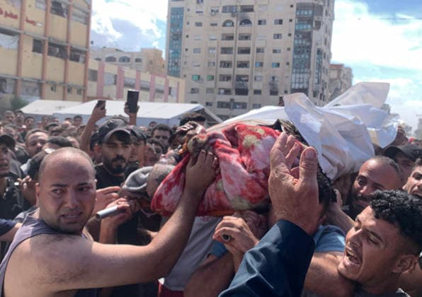Palestinians carry the body of a man after he was targeted by Israeli military aircraft in western Gaza City, on October 2, 2026. Photo by Ahmed Al-Shawah apaimages Gaza Gaza Strip Palestinian Territory 021026_Gaza_ASH_00(8) Copyright: xapaimagesxAhmedxAl-Shawah xapaimagesx