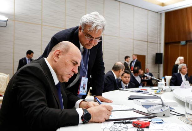BELARUS, MINSK - OCTOBER 2, 2026: Mikhail Mishustin, Russia s Prime Minister, signs final documents during an expanded meeting of the Eurasian Intergovernmental Council, with Elmir Tagirov, Deputy Chief of the Government Staff, in the background Minsk Belarus  - ZUMAt113 20261002_zaa_t113_271 Copyright: xDmitryxAstakhovx
