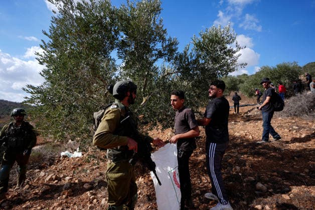 Israeli settlers intervene against Palestinians olive-picking event in Nablus town NABLUS, WEST BANK, PALESTINE - OCTOBER 02: Israeli settlers, under the protection of Israeli forces, intervene against an olive-picking event organized by Palestinians and a group of activists in the town of Beita, in Nablus, West Bank, Palestine on October 02, 2026. Issam Rimawi Anadolu Nablus West Bank. Editorial use only. Please get in touch for any other usage. Copyright: x2026xAnadoluxIssamxRimawix