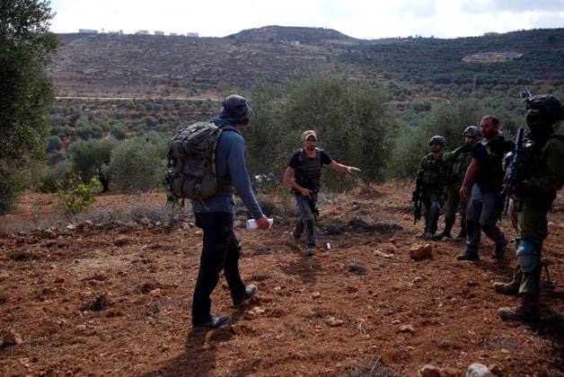 Israeli settlers intervene against Palestinians olive-picking event in Nablus town NABLUS, WEST BANK, PALESTINE - OCTOBER 02: Israeli settlers, under the protection of Israeli forces, intervene against an olive-picking event organized by Palestinians and a group of activists in the town of Beita, in Nablus, West Bank, Palestine on October 02, 2026. Issam Rimawi Anadolu Nablus West Bank. Editorial use only. Please get in touch for any other usage. Copyright: x2026xAnadoluxIssamxRimawix