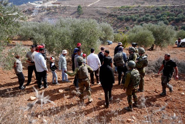 Israeli settlers intervene against Palestinians olive-picking event in Nablus town NABLUS, WEST BANK, PALESTINE - OCTOBER 02: Israeli settlers, under the protection of Israeli forces, intervene against an olive-picking event organized by Palestinians and a group of activists in the town of Beita, in Nablus, West Bank, Palestine on October 02, 2026. Issam Rimawi Anadolu Nablus West Bank. Editorial use only. Please get in touch for any other usage. Copyright: x2026xAnadoluxIssamxRimawix