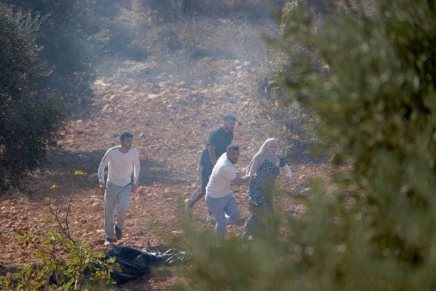 Israeli settlers intervene against Palestinians olive-picking event in Nablus town NABLUS, WEST BANK, PALESTINE - OCTOBER 02: Israeli settlers, under the protection of Israeli forces, intervene against an olive-picking event organized by Palestinians and a group of activists in the town of Beita, in Nablus, West Bank, Palestine on October 02, 2026. Issam Rimawi Anadolu Nablus West Bank. Editorial use only. Please get in touch for any other usage. Copyright: x2026xAnadoluxIssamxRimawix