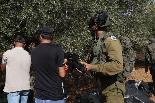 Israeli Settlers And Forces Attacked Palestinian Farmers During Olive Harvest In Beita BEITA, NABLUS, PALESTINE OCTOBER 2, 2026: Israeli settlers and Israeli forces attacked Palestinian farmers while they were picking olives in the Jabal Al-Arma area, east of Beita, south of Nablus. Settlers fired live ammunition toward the farmers, with no injuries reported. According to the Palestinian Red Crescent Society, Israeli forces also beat a 46-year-old Palestinian farmer during raids on olive farms in Beita. Witnesses told Anadolu that Israeli forces fired stun grenades and tear gas at farmers in the Jabal Al-Arma area, forcing them to leave. The olive harvest begins in early October and continues through the end of November, making it an im Copyright: x xSalmanxMohsenxAlkhatibx xJNAxPressx