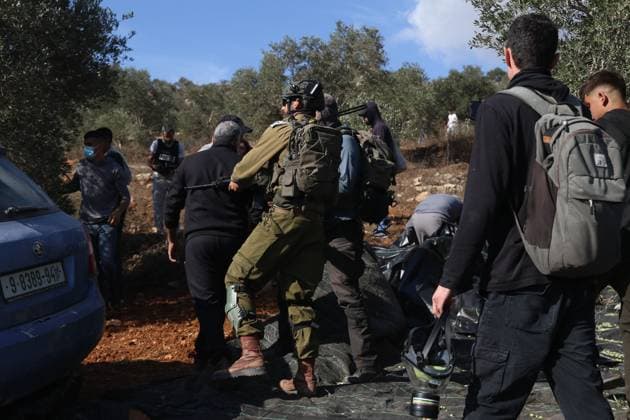 October 2, 2026, Nablus, Palestine, State of: BEITA, NABLUS, PALESTINE Ã¢â‚¬ OCTOBER 2, 2026: Israeli settlers and Israeli forces attacked Palestinian farmers while they were picking olives in the Jabal Al-Arma area, east of Beita, south of Nablus. Settlers fired live ammunition toward the farmers, with no injuries reported. According to the Palestinian Red Crescent Society, Israeli forces also beat a 46-year-old Palestinian farmer during raids on olive farms in Beita. Witnesses told Anadolu that Israeli forces fired stun grenades and tear gas at farmers in the Jabal Al-Arma area, forcing them to leave. The olive harvest begins in early October and continues through the end of November, making it an important agricultural and economic se - ZUMAq101 20261002_zna_q101_059 Copyright: xSalmanxMohsenxAlkhatibx