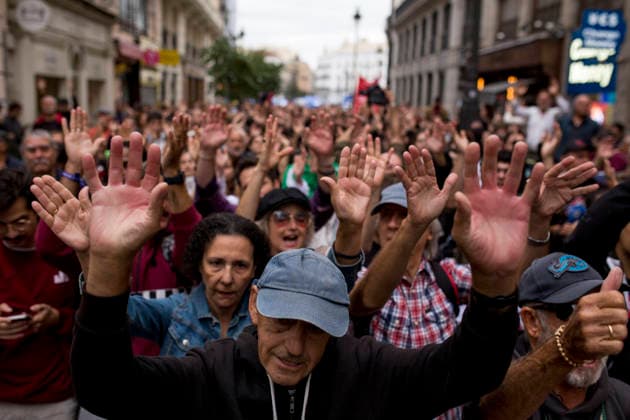 October 2, 2026, Madrid, Spain: Protesters raise their hands while shouting during the demonstration. The protest in front of the Congress of Deputies in Madrid, demanding the approval of measures to address the housing and rental crisis in Spain. The demonstration was organized by protesters camping in Puerta del Sol in central Madrid. Madrid Spain - ZUMAs197 20261002_aaa_s197_068 Copyright: xLuisxSotox