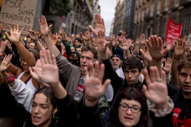 October 2, 2026, Madrid, Spain: Protesters raise their hands while shouting during the demonstration. The protest in front of the Congress of Deputies in Madrid, demanding the approval of measures to address the housing and rental crisis in Spain. The demonstration was organized by protesters camping in Puerta del Sol in central Madrid. Madrid Spain - ZUMAs197 20261002_aaa_s197_066 Copyright: xLuisxSotox