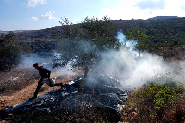 Israeli forces injure Palestinian farmer during raids on olive farms NABLUS, WEST BANK, PALESTINE - OCTOBER 2: Israeli military forces and settlers intervene against Palestinian farmers and international activists harvesting olives in the town of Beita, in Nablus, West Bank, Palestine on October 02, 2026. Israeli settlers beat the 46-year-old Palestinian man in the town of Beita, according to the Palestinian Red Crescent Society. Witnesses told Anadolu that a group of Israeli settlers fired stun grenades and tear gas at farmers in the Jabal al-Arma area, forcing them to leave. Issam Rimawi Anadolu Nablus West Bank. Editorial use only. Please get in touch for any other usage.  Copyright: x2026xAnadoluxIssamxRimawix