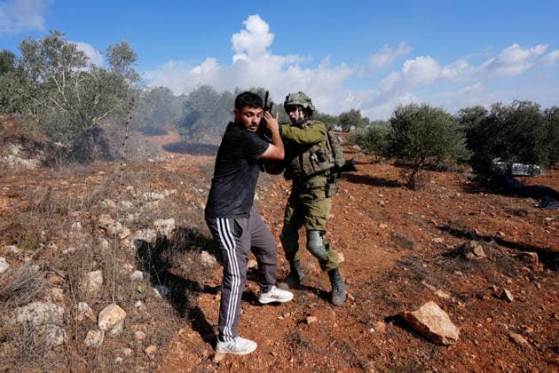 Israeli forces injure Palestinian farmer during raids on olive farms NABLUS, WEST BANK, PALESTINE - OCTOBER 2: Israeli military forces and settlers intervene against Palestinian farmers and international activists harvesting olives in the town of Beita, in Nablus, West Bank, Palestine on October 02, 2026. Israeli settlers beat the 46-year-old Palestinian man in the town of Beita, according to the Palestinian Red Crescent Society. Witnesses told Anadolu that a group of Israeli settlers fired stun grenades and tear gas at farmers in the Jabal al-Arma area, forcing them to leave. Issam Rimawi Anadolu Nablus West Bank. Editorial use only. Please get in touch for any other usage.  Copyright: x2026xAnadoluxIssamxRimawix
