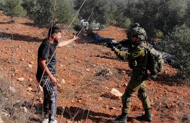 Israeli forces injure Palestinian farmer during raids on olive farms NABLUS, WEST BANK, PALESTINE - OCTOBER 2: Israeli military forces and settlers intervene against Palestinian farmers and international activists harvesting olives in the town of Beita, in Nablus, West Bank, Palestine on October 02, 2026. Israeli settlers beat the 46-year-old Palestinian man in the town of Beita, according to the Palestinian Red Crescent Society. Witnesses told Anadolu that a group of Israeli settlers fired stun grenades and tear gas at farmers in the Jabal al-Arma area, forcing them to leave. Issam Rimawi Anadolu Nablus West Bank. Editorial use only. Please get in touch for any other usage.  Copyright: x2026xAnadoluxIssamxRimawix