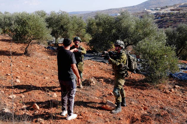 Israeli forces injure Palestinian farmer during raids on olive farms NABLUS, WEST BANK, PALESTINE - OCTOBER 2: Israeli military forces and settlers intervene against Palestinian farmers and international activists harvesting olives in the town of Beita, in Nablus, West Bank, Palestine on October 02, 2026. Israeli settlers beat the 46-year-old Palestinian man in the town of Beita, according to the Palestinian Red Crescent Society. Witnesses told Anadolu that a group of Israeli settlers fired stun grenades and tear gas at farmers in the Jabal al-Arma area, forcing them to leave. Issam Rimawi Anadolu Nablus West Bank. Editorial use only. Please get in touch for any other usage.  Copyright: x2026xAnadoluxIssamxRimawix