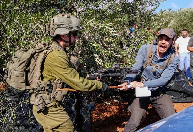 Israeli forces injure Palestinian farmer during raids on olive farms NABLUS, WEST BANK, PALESTINE - OCTOBER 2: Israeli military forces and settlers intervene against Palestinian farmers and international activists harvesting olives in the town of Beita, in Nablus, West Bank, Palestine on October 02, 2026. Israeli settlers beat the 46-year-old Palestinian man in the town of Beita, according to the Palestinian Red Crescent Society. Witnesses told Anadolu that a group of Israeli settlers fired stun grenades and tear gas at farmers in the Jabal al-Arma area, forcing them to leave. Issam Rimawi Anadolu Nablus West Bank. Editorial use only. Please get in touch for any other usage.  Copyright: x2026xAnadoluxIssamxRimawix