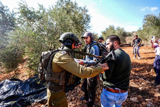 Israeli forces injure Palestinian farmer during raids on olive farms NABLUS, WEST BANK, PALESTINE - OCTOBER 2: Israeli military forces and settlers intervene against Palestinian farmers and international activists harvesting olives in the town of Beita, in Nablus, West Bank, Palestine on October 02, 2026. Israeli settlers beat the 46-year-old Palestinian man in the town of Beita, according to the Palestinian Red Crescent Society. Witnesses told Anadolu that a group of Israeli settlers fired stun grenades and tear gas at farmers in the Jabal al-Arma area, forcing them to leave. Issam Rimawi Anadolu Nablus West Bank. Editorial use only. Please get in touch for any other usage.  Copyright: x2026xAnadoluxIssamxRimawix