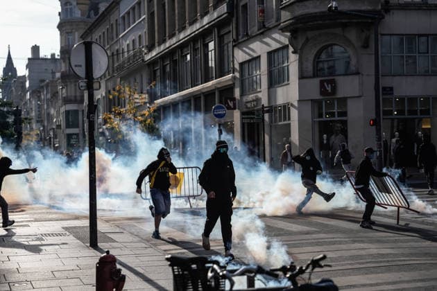 Students clash with police during high-school mobilization in Nancy NANCY, FRANCE - OCTOBER 2: Students clash with security forces as nationwide high-school mobilization continues over school conditions and demands for greater education resources in Nancy, France on October 2, 2026. Law enforcement officers used tear gas to disperse student crowds protesting across multiple school locations as part of nationwide mobilizations over education resources and school conditions. Police deploy security units around several locations as demonstrations and blockades continue. Muhammed Said Tako Anadolu Nancy France. Editorial use only. Please get in touch for any other usage.  Copyright: x2026xAnadoluxMuhammedxSaidxTakox