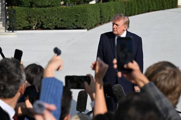 October 2, 2026, Washington, Dc, USA: U.S. President Donald Trump talks to the media before boarding Marine One on the South Lawn of the White House in Washington, DC, United States, on October 2, 2026. Washington USA - ZUMAs197 20261002_aaa_s197_266 Copyright: xKylexMazzax