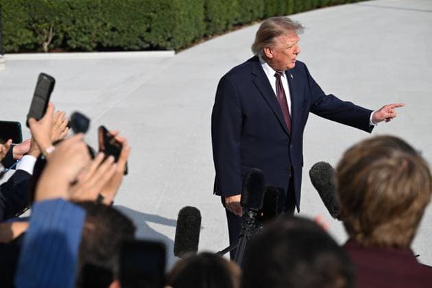 October 2, 2026, Washington, Dc, USA: U.S. President Donald Trump talks to the media before boarding Marine One on the South Lawn of the White House in Washington, DC, United States, on October 2, 2026. Washington USA - ZUMAs197 20261002_aaa_s197_261 Copyright: xKylexMazzax