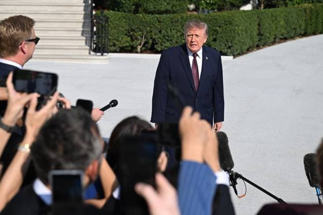October 2, 2026, Washington, Dc, USA: U.S. President Donald Trump talks to the media before boarding Marine One on the South Lawn of the White House in Washington, DC, United States, on October 2, 2026. Washington USA - ZUMAs197 20261002_aaa_s197_283 Copyright: xKylexMazzax