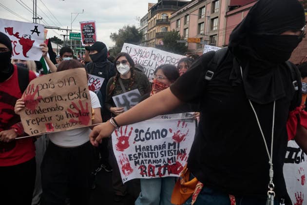 October 2, 2026, Mexico City, Cdmx, Mexico: Thousands of people carrying placards gathered at the Plaza de las Tres Culturas and the surrounding area to commemorate the 58th anniversary of the 1968 student massacre in Tlatelolco; they marched toward Mexico City s Zo³calo to hold a rally in memory of those who died during the 1968 student movement. Prior to this, hundreds of students arrived at the meeting point near the Tlatelolco Metro station, where a heavy police deployment from the Secretariat of Citizen Security (SSCCDMX) was already waiting for them; these hooded officers on motorcycles boxed the students in, both inside and outside the metro facilities, to prevent their peaceful movement, sparking conflict through abuses of authori - ZUMAp204 20261002_zip_p204_130 Copyright: xJosuexPerezx