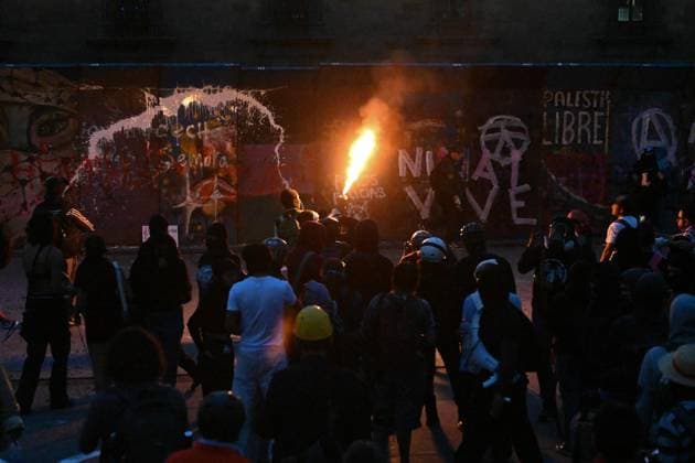 October 2, 2026: TO-45324-MEXICO , October 2, 2026. Student leaders from 1968 marched alongside students from various public universities, feminist collectives, "searching mothers," and Indigenous people from diverse regions to commemorate the anniversary of the Tlatelolco Massacre. They chanted slogans such as "No forgiveness, no forgetting," "Death to the State," and "It was the military." They marched along various avenues in the Mexican capital, concluding their rally at the Z& xf3;calo plaza, where clashes broke out with police stationed behind the barriers guarding the National Palace. In Mexico City. Clasos.com.mx - ZUMAcs4_ 20261002_faa_cs4_237 Copyright: xJavierxLiraxOterox