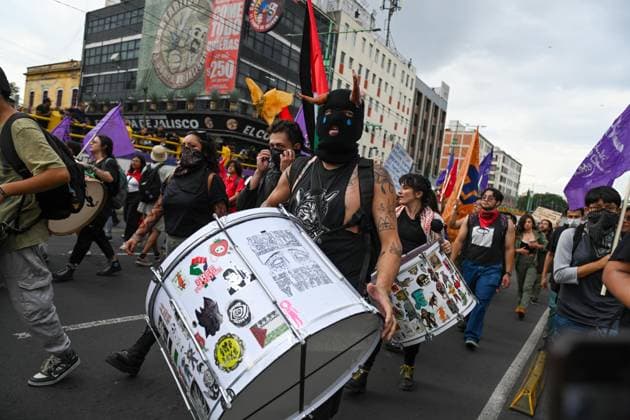 October 2, 2026: TO-45322-MEXICO , October 2, 2026. Student leaders from 1968 marched alongside students from various public universities, feminist collectives, "searching mothers," and Indigenous people from diverse regions to commemorate the anniversary of the Tlatelolco Massacre. They chanted slogans such as "No forgiveness, no forgetting," "Death to the State," and "It was the military." They marched along various avenues in the Mexican capital, concluding their rally at the Z& xf3;calo plaza, where clashes broke out with police stationed behind the barriers guarding the National Palace. In Mexico City. Clasos.com.mx - ZUMAcs4_ 20261002_faa_cs4_119 Copyright: xJavierxLiraxOterox