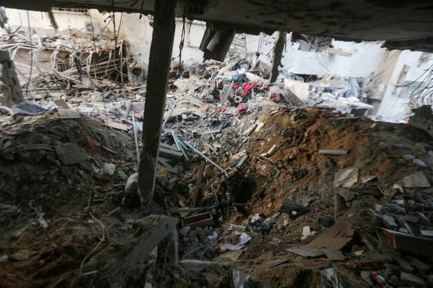 October 3, 2026, Gaza City, Gaza Strip, Palestinian Territory: Palestinians inspect the destruction after Israeli aircraft targeted a residential apartment in the Al-Rimal neighborhood of western Gaza City early in the morning. According to local sources, five Palestinians were killed, including four women. Among those killed were a Christian mother and her daughter. Gaza City Palestinian Territory - ZUMAz119 20261003_zip_z119_006 Copyright: xSalahxHashemx