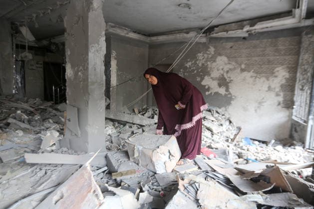 October 3, 2026, Gaza City, Gaza Strip, Palestinian Territory: Palestinians inspect the destruction after Israeli aircraft targeted a residential apartment in the Al-Rimal neighborhood of western Gaza City early in the morning. According to local sources, five Palestinians were killed, including four women. Among those killed were a Christian mother and her daughter. Gaza City Palestinian Territory - ZUMAz119 20261003_zip_z119_008 Copyright: xSalahxHashemx