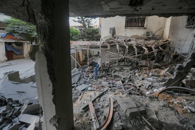 October 3, 2026, Gaza City, Gaza Strip, Palestinian Territory: Palestinians inspect the destruction after Israeli aircraft targeted a residential apartment in the Al-Rimal neighborhood of western Gaza City early in the morning. According to local sources, five Palestinians were killed, including four women. Among those killed were a Christian mother and her daughter. Gaza City Palestinian Territory - ZUMAz119 20261003_zip_z119_005 Copyright: xSalahxHashemx