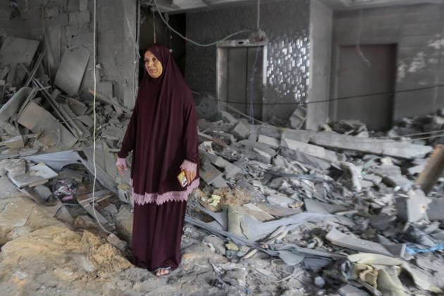 October 3, 2026, Gaza City, Gaza Strip, Palestinian Territory: Palestinians inspect the destruction after Israeli aircraft targeted a residential apartment in the Al-Rimal neighborhood of western Gaza City early in the morning. According to local sources, five Palestinians were killed, including four women. Among those killed were a Christian mother and her daughter. Gaza City Palestinian Territory - ZUMAz119 20261003_zip_z119_007 Copyright: xSalahxHashemx