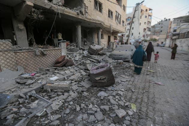 October 3, 2026, Gaza City, Gaza Strip, Palestinian Territory: Palestinians inspect the destruction after Israeli aircraft targeted a residential apartment in the Al-Rimal neighborhood of western Gaza City early in the morning. According to local sources, five Palestinians were killed, including four women. Among those killed were a Christian mother and her daughter. Gaza City Palestinian Territory - ZUMAz119 20261003_zip_z119_001 Copyright: xSalahxHashemx